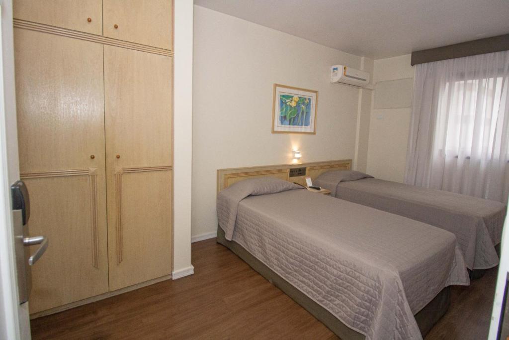 Luxo Duplo Solteiro – Trevi Hotel & Business